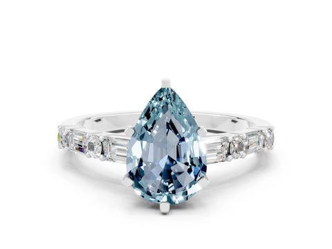White gold Pear Cut Aquamarine Solitaire with Side Baguettes and Channel Set Band