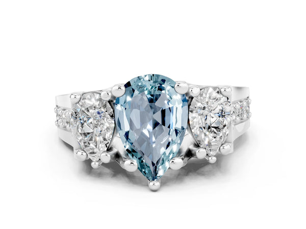 White gold Pear Cut Aquamarine Three-Stone Ring with Channel Set Band and Four-Prong Setting