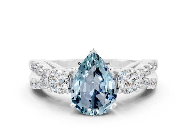 Silver Pear Cut Aquamarine Three-Stone Ring with Pavé Split Shank and Four-Prong Setting