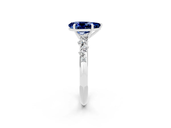 Platinum Pear Cut Blue Sapphire Cluster Side Stone Solitaire Ring with Prong Setting
