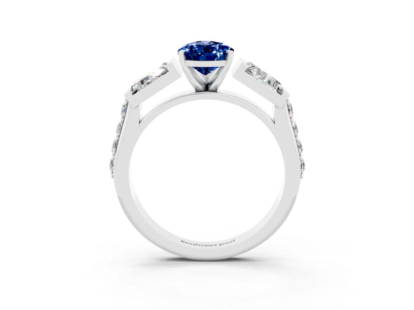 White gold Pear Cut Blue Sapphire Engagement Ring with Baguette Side Stones and Channel Set Band