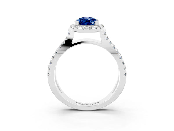 Platinum Pear Cut Blue Sapphire Halo Ring with Split Shank Pavé Band and Prong Setting