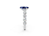 White gold Pear Cut Blue Sapphire Prong Setting with Side Stones on a Pave Band_2