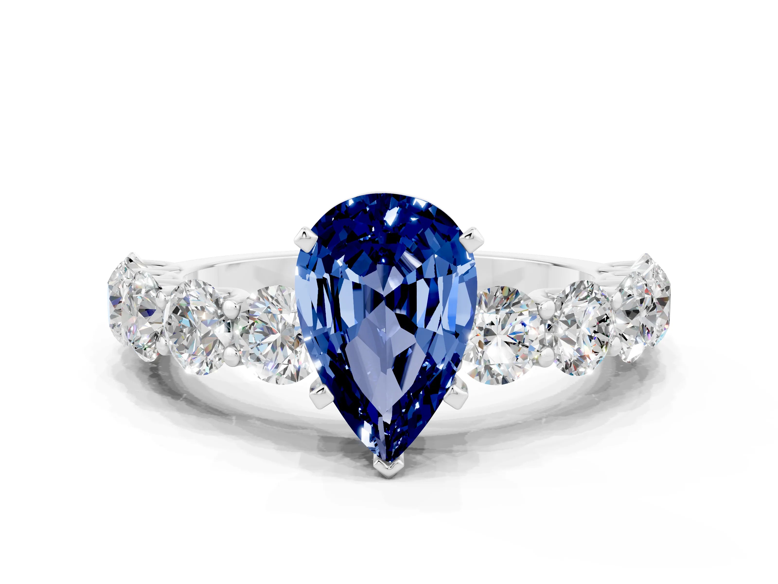 White gold Pear Cut Blue Sapphire Prong Setting with Side Stones on a Pave Band