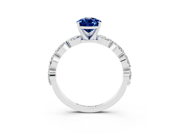 Platinum Pear Cut Blue Sapphire Ring with Marquise Side Stones and Prong Setting