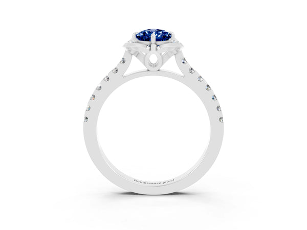 Platinum Pear Cut Blue Sapphire Ring with Pavé Band and Floral Prong Setting