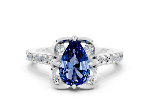 White gold Pear Cut Blue Sapphire Ring with Pavé Band and Floral Prong Setting