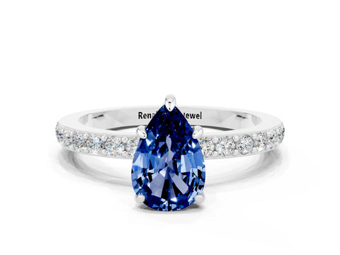 White gold Pear Cut Blue Sapphire Ring with Pavé Band and Four-Prong Setting