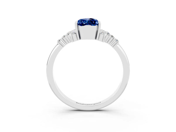 White gold Pear Cut Blue Sapphire Ring with Side Stones and Four-Prong Setting