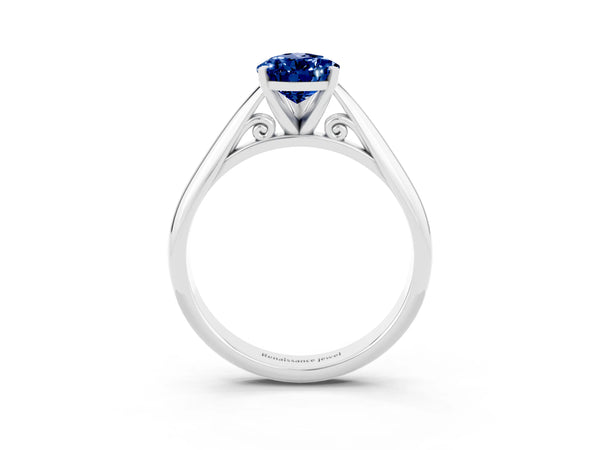 Silver Pear Cut Blue Sapphire Solitaire Engagement Ring with Cathedral Setting and Four-Prong Mount