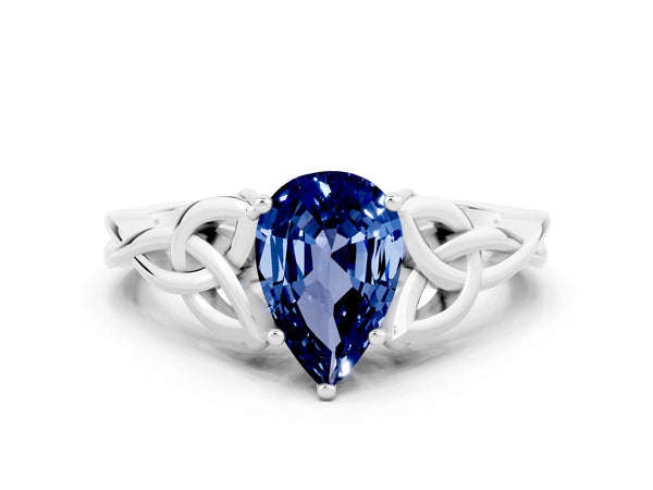 Silver Pear Cut Blue Sapphire Solitaire Engagement Ring with Celtic Knot Band and Four-Prong Setting