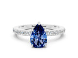 White gold Pear Cut Blue Sapphire Solitaire Engagement Ring with Pavé Band and Four-Prong Setting