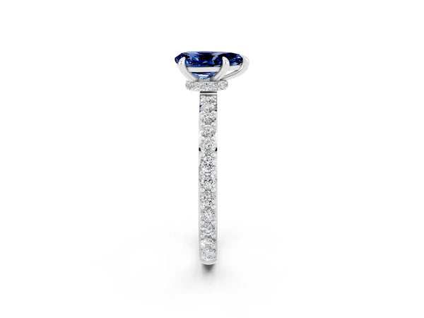 Platinum Pear Cut Blue Sapphire Solitaire Engagement Ring with Pavé Band and Four-Prong Setting