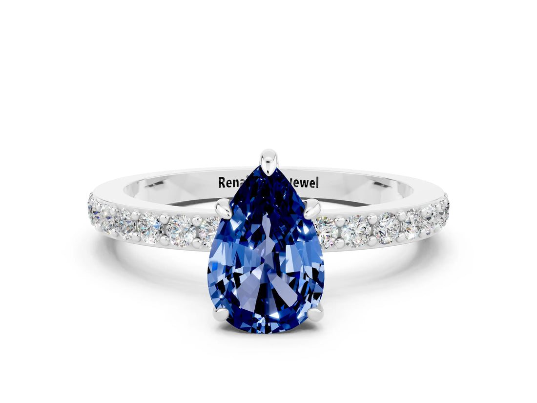 White gold Pear Cut Blue Sapphire Solitaire Engagement Ring with Pavé Band and Four-Prong Setting