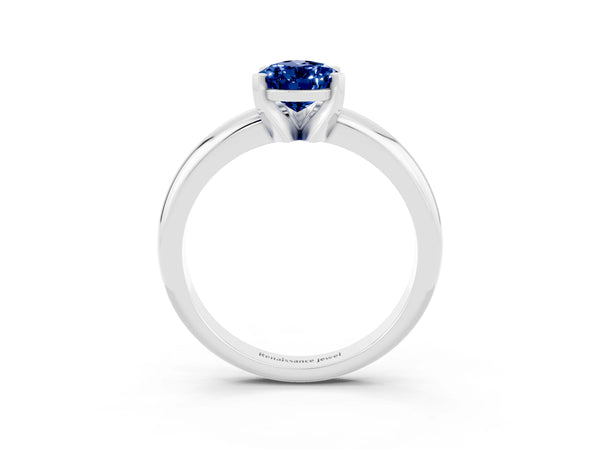 Platinum Pear Cut Blue Sapphire Solitaire Engagement Ring with Round Band and Four-Prong Setting