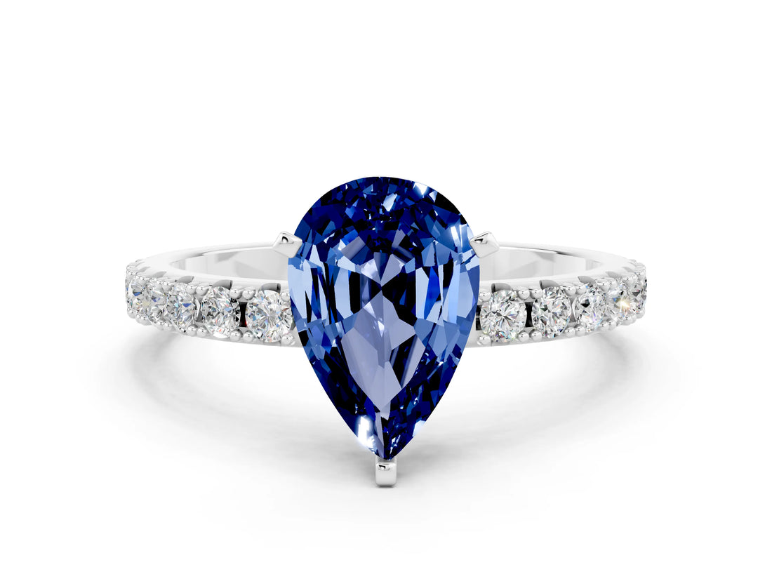 White gold Pear Cut Blue Sapphire Solitaire Pavé Band with Four-Prong Setting