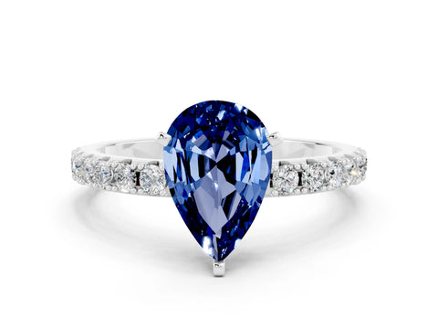 White gold Pear Cut Blue Sapphire Solitaire Pavé Band with Four-Prong Setting