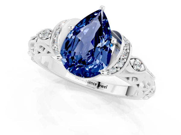 Platinum Pear Cut Blue Sapphire Solitaire Ring with Filigree Band and Four-Prong Setting
