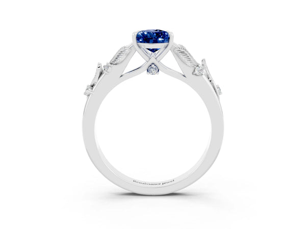 Platinum Pear Cut Blue Sapphire Solitaire Ring with Leaf Motif Band and Four-Prong Setting