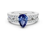 White gold Pear Cut Blue Sapphire Solitaire Ring with Pavé and Channel Set Band