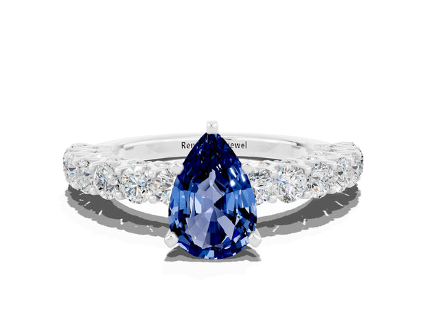 White gold Pear Cut Blue Sapphire Solitaire Ring with Shared Prong Pavé Band and Four-Prong Setting