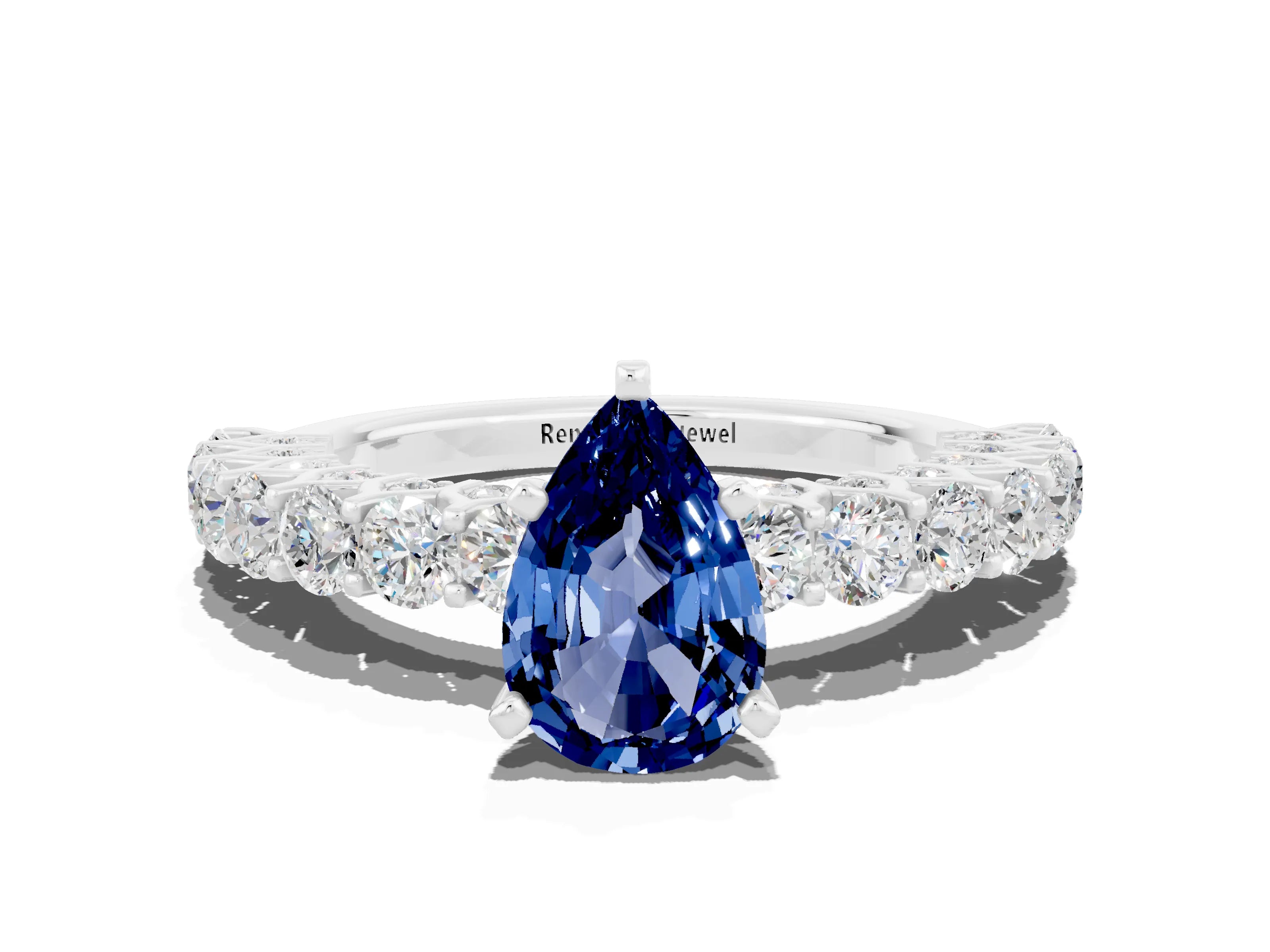 White gold Pear Cut Blue Sapphire Solitaire Ring with Shared Prong Pavé Band and Four-Prong Setting