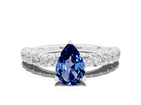 White gold Pear Cut Blue Sapphire Solitaire Ring with Shared Prong Pavé Band and Four-Prong Setting