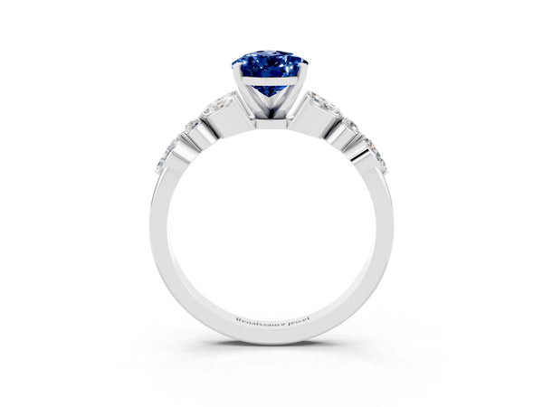 Platinum Pear Cut Blue Sapphire Solitaire Ring with Side Stones and Four-Prong Setting
