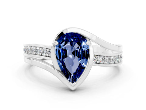 White gold Pear Cut Blue Sapphire Solitaire Ring with Split Shank and Prong Setting