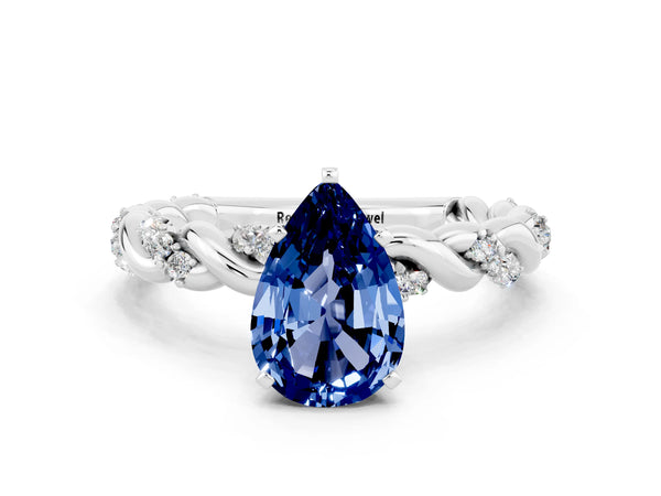 Platinum Pear Cut Blue Sapphire Solitaire Ring with Twisted Band and Pavé Accents