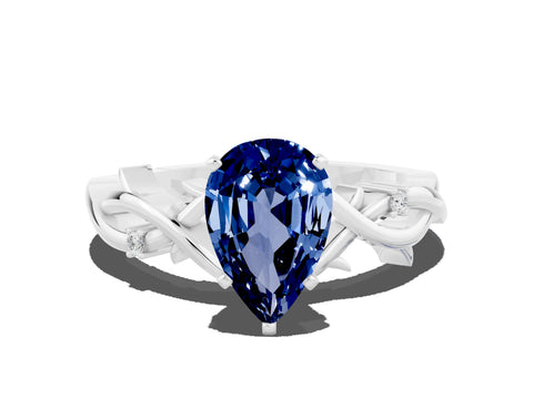 White gold Pear Cut Blue Sapphire Solitaire Ring with Twisted Band and Prong Setting