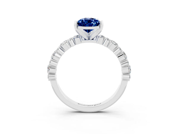 Platinum Pear Cut Blue Sapphire Side Stone Solitaire Ring with Round  and Four-Prong Setting