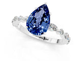 White gold Pear Cut Blue Sapphire Solitaire with Side Stones on a Pavé Band and Four-Prong Setting_1