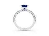 White gold Pear Cut Blue Sapphire Solitaire with Side Stones on a Pavé Band and Four-Prong Setting_3
