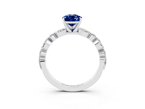 White gold Pear Cut Blue Sapphire Solitaire with Side Stones on a Pavé Band and Four-Prong Setting_3