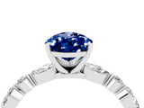 White gold Pear Cut Blue Sapphire Solitaire with Side Stones on a Pavé Band and Four-Prong Setting_4