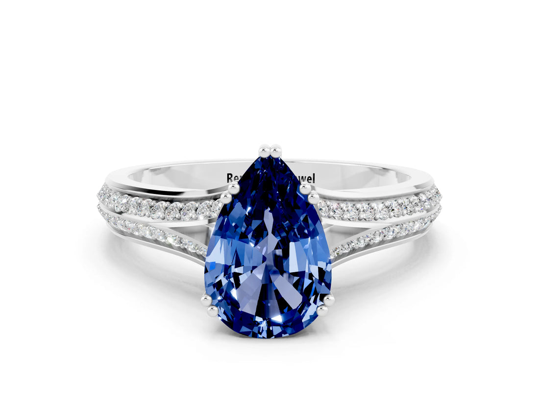 White gold Pear Cut Blue Sapphire Split Shank Engagement Ring with Pavé Band