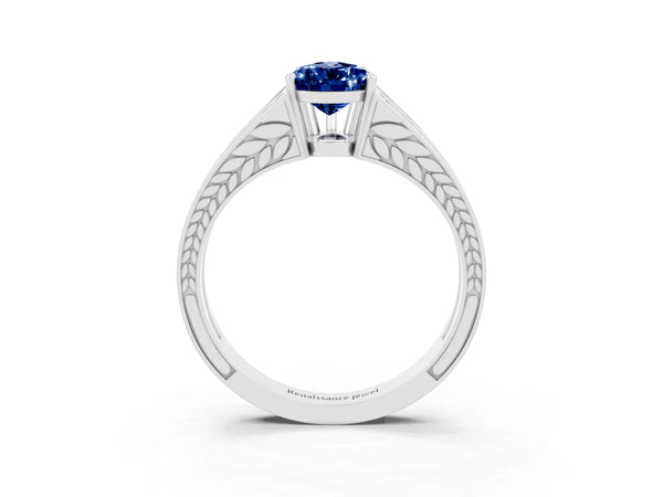 White gold Pear Cut Blue Sapphire Split Shank Ring with Pavé Band and Four-Prong Setting