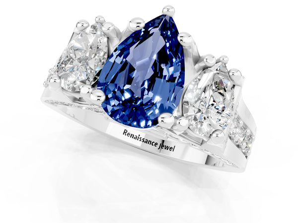 White gold Pear Cut Blue Sapphire Three-Stone Ring with Channel Set Band and Four-Prong Setting