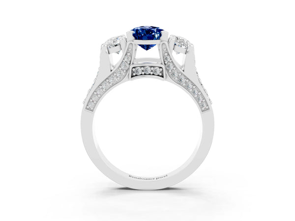 Silver Pear Cut Blue Sapphire Three-Stone Ring with Channel Set Band and Four-Prong Setting