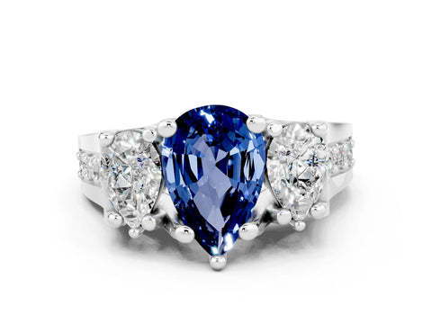White gold Pear Cut Blue Sapphire Three-Stone Ring with Channel Set Band and Four-Prong Setting
