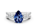White gold Pear Cut Blue Sapphire Three-Stone Ring with Pavé Split Shank and Four-Prong Setting_12