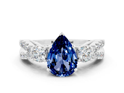 White gold Pear Cut Blue Sapphire Three-Stone Ring with Pavé Split Shank and Four-Prong Setting_12
