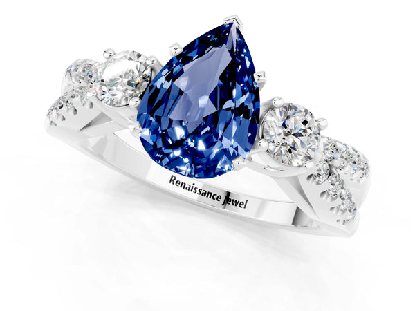 Platinum Pear Cut Blue Sapphire Three-Stone Ring with Pavé Split Shank and Four-Prong Setting