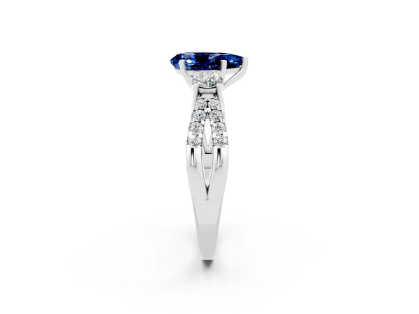 White gold Pear Cut Blue Sapphire Three-Stone Ring with Pavé Split Shank and Four-Prong Setting