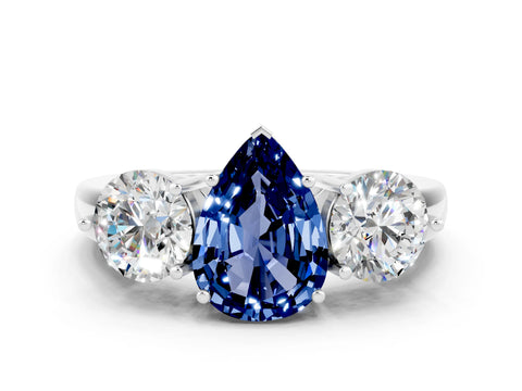 White gold Pear Cut Blue Sapphire Three-Stone Ring with Prong Setting and Classic Band