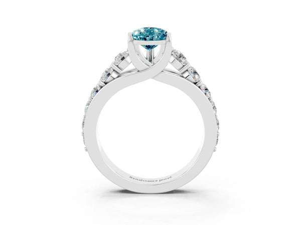 Silver Pear Cut Blue Topaz Engagement Ring with Pavé Band and Four-Prong Setting