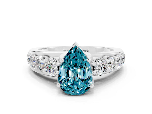 Silver Pear Cut Blue Topaz Engagement Ring with Pavé Band and Four-Prong Setting