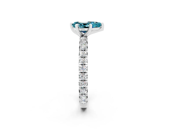 Platinum Pear Cut Blue Topaz Pavé Solitaire Ring with Round Band and Prong Setting