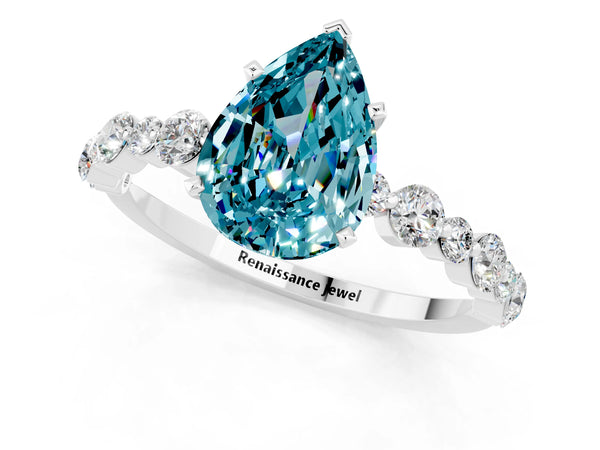 White gold Pear Cut Blue Topaz Prong Set Engagement Ring with Pavé Band